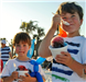 two boys eating a snocone