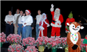 councilmen and santa on stage