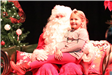girl sitting on santa's lap