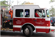 Santa getting out of a firetruck
