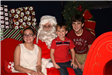 family sitting with Santa