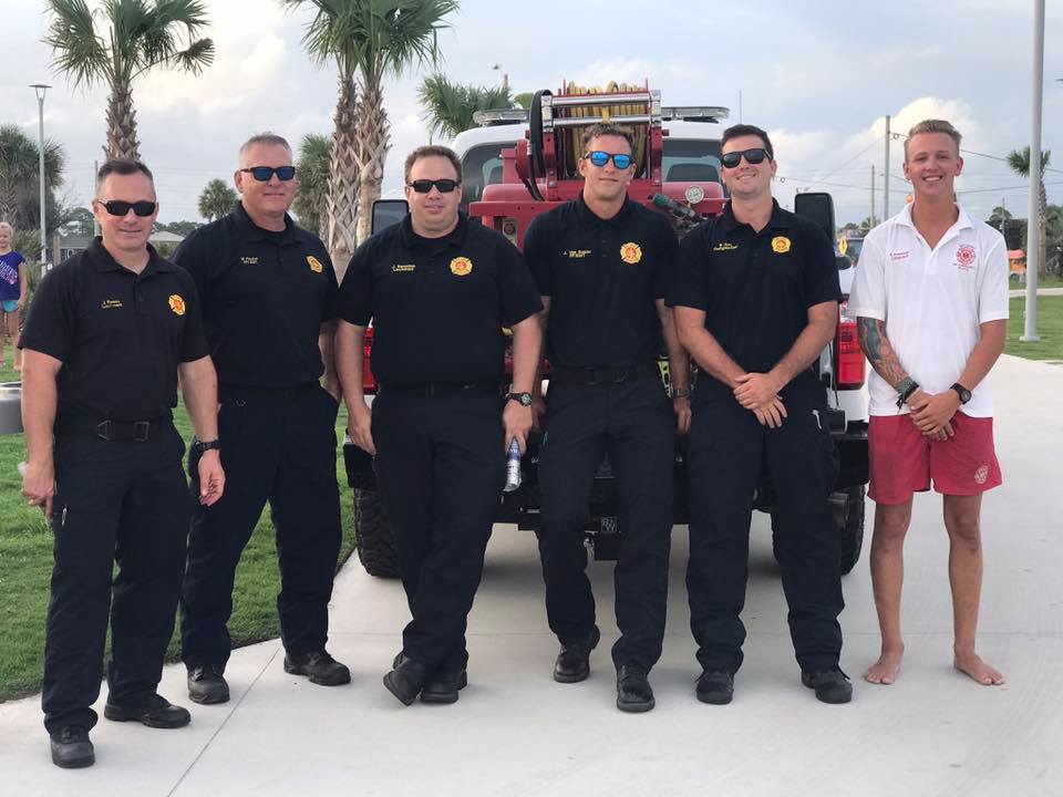 firefighters posing for photo
